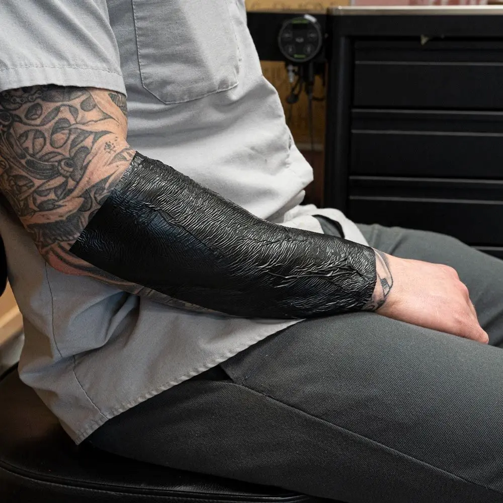 nuovo tatuaggio dopo la cura pellicola nera rotolo di pellicola traspirante  tatuaggio nastro protettivo