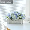 New wooden fence, white roses, and blue...