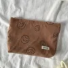 Brown smiley face storage bag