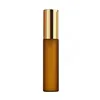 Frosted amber glass bottle + gold cap