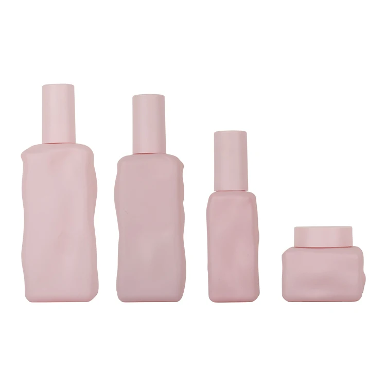 Wholesale pink luxury skincare packaging set empty lotion pump glass bottle and jar cosmetic cream bottle with plastic pump