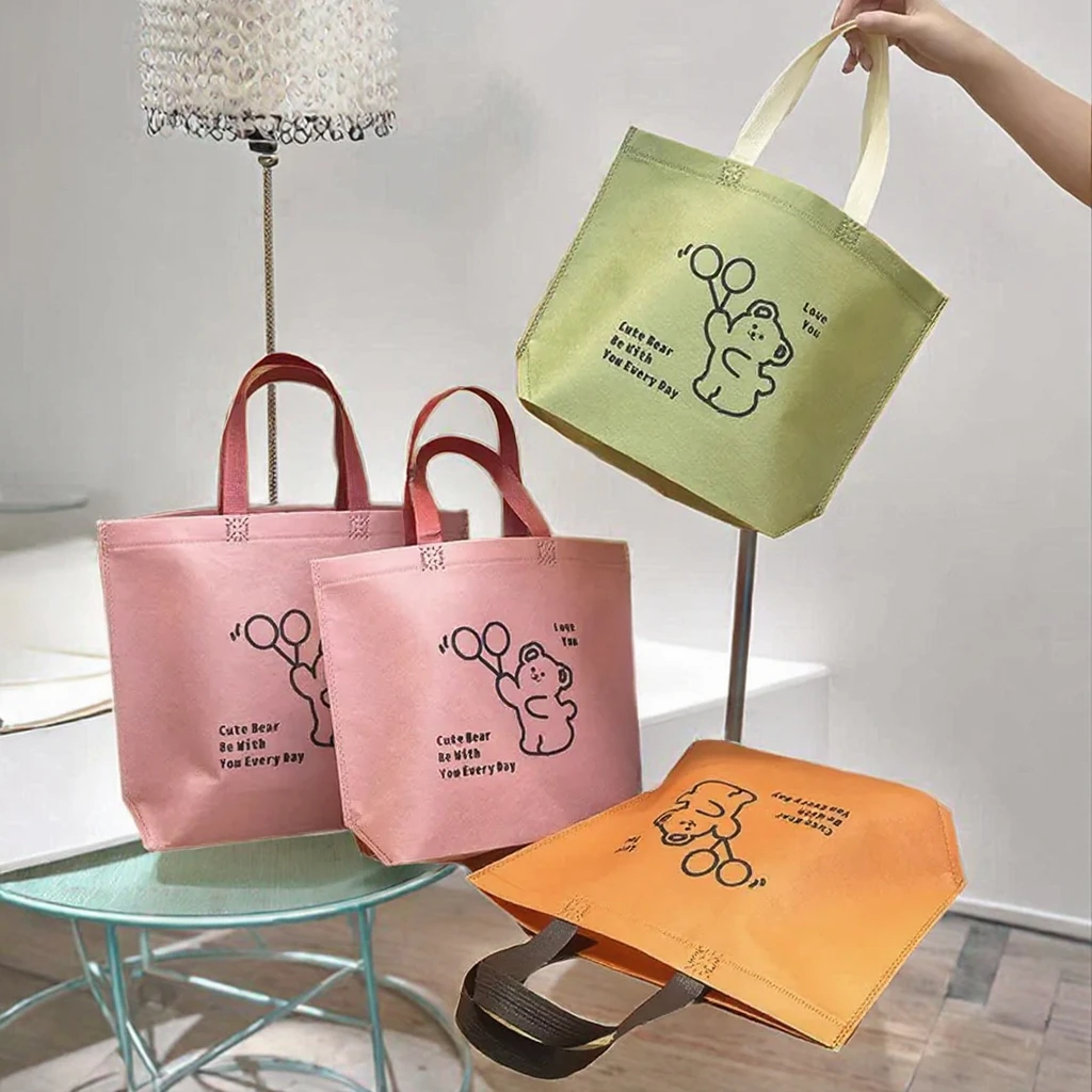 Wenzhou Customized Letter Pattern Spunbond Non-Woven Fabric Tote Bags Long Eco-Friendly PP Wholesale Cheap Shopping Bags supplier