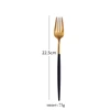 Tenedor de mesa negro y dorado