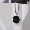 14# Insignia redonda negra
