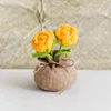 Bolsa de la suerte con rosa naranja de dos cabezas