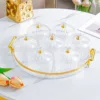 Transparent gold-rimmed round fruit platter with 7 dishes