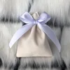 Beige Bag with Purple Ribbon