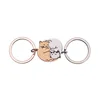 Steel color + rose gold keychain pair