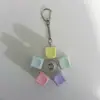 Colorful rotating button keychain with bear head