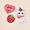 Heart-shaped strawberry and white cat embroidered patch