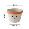 Cara sonriente gris cemento grande 20cm