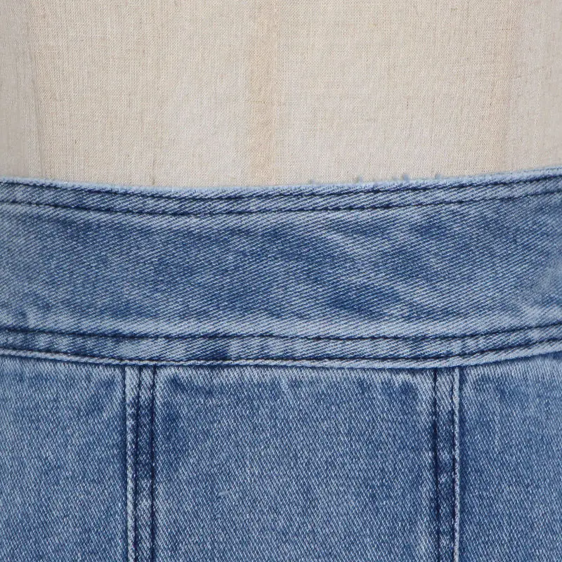 Uformell blå jeansskjørt med høy liv, patchwork, ruller, uregelmessig høy liv, løst fritidsdesign og asymmetrisk nederkant for kvinner