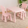 Pink table, 2 square-backed chairs, and anti-slip pads included.