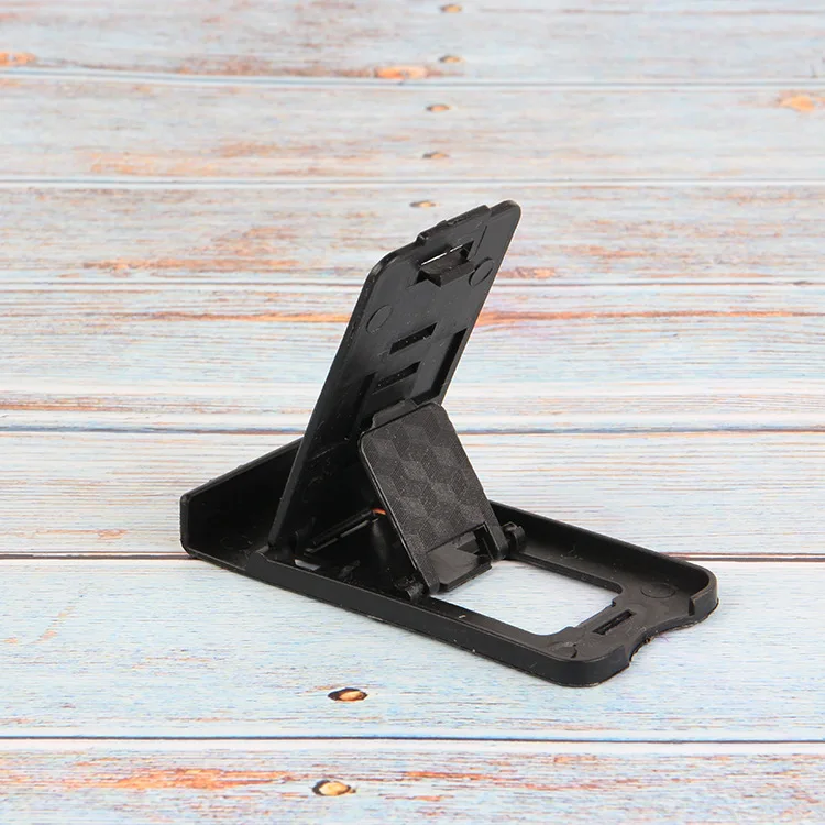 Foldable universal adjustable mobile phone holder