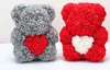 fat red bear with white heart with box