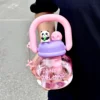 rosa con peluche de panda y colgante de cachorro