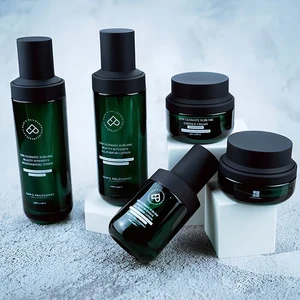 Custom Dark Green Luxury Glass Lotion Bottle Cream Jar Set Empty Cosmetics Packaging for Skin Care Serum round Cylinder Design