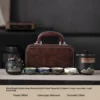 Black green mountain bird+small brown bag