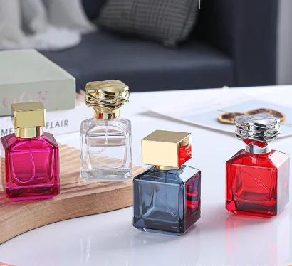 Hot Sale 50ML square Custom Color Red Transparent Perfume Glass Bottle with Flower-shaped Gold and Silver Lid