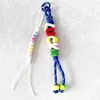 Cordón de cera con cuentas y letras de la suerte