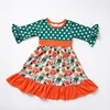 Vestido verde de lunares con estampado floral y mangas acampanadas
