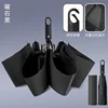 Paraguas plegable automático con hebilla de anillo negro obsidiana y tela táctil.