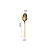 Golden tea spoon