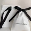 White Bag with Black Ribbon