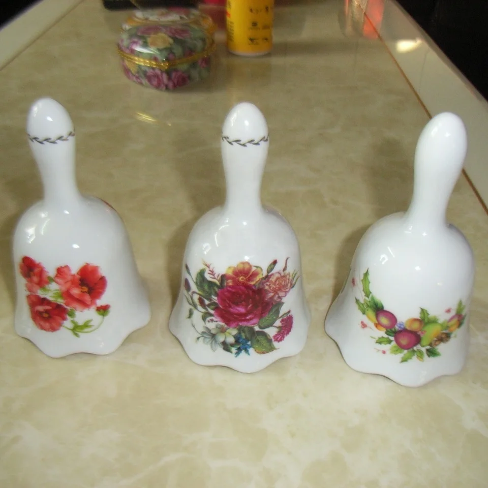 Porcelain souvenir bell with flower design bone china wedding bell decoration