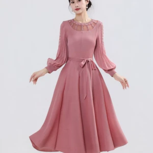 Elegant Lady's Oversized Pleated Dress with Beaded Collar and Frilly Sleeves Design
