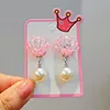 Pink shell-shaped ear clips with ab glue