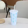 White cup with blue bow