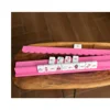 bois de poussoir rose vif
