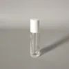 Clear bottle + glass ball + white plastic cap