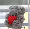 fat grey bear with red heart with box