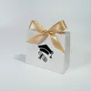 White bag with gold ribbon