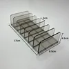 Row of small seven-compartment transparent gray