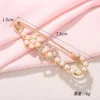 Broche perle en forme de coeur