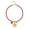 Collana rossa con stella a cinque punte