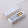 Clear glass spray bottle + double line gold cap + white box