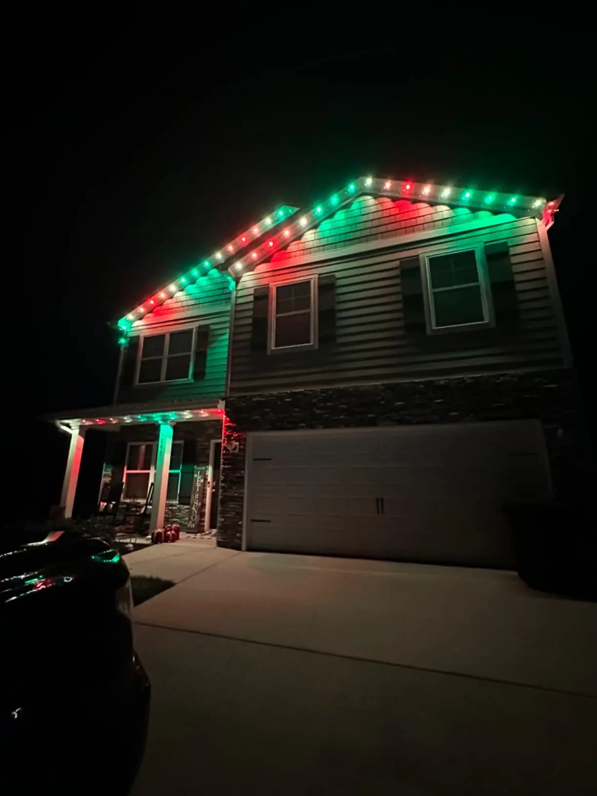 House at night with patriotic red, white, and blue EverGlow LED lights