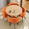 Orange yellow fabric table and four chairs