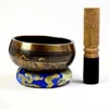singing bowl and leather stick and cushion