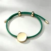 Cordoncino verde+ciondolo dorato
