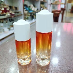 Luxury 1oz 20ml Orange Glass Dropper Bottle with Unique Rubber Top Unique Color Coating for Cosmetic Face Push Button Eye Drops