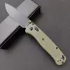 Black blade with a green handle