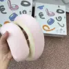 Almohada de viaje en espiral rosa