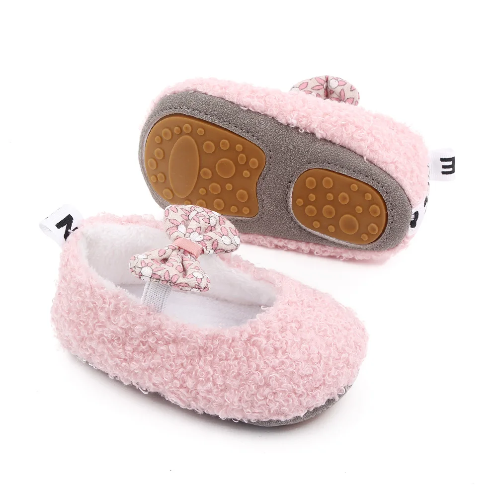 Autumn and Winter 0-1 Year Old Baby Solid Color Fluffy Cute Bow Warm Soft Soled Cotton Shoes supplier