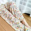 Pantaloni larghi in cotone con motivo floreale color albicocca