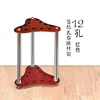 Triangular red 12-hole floor-standing pole stand